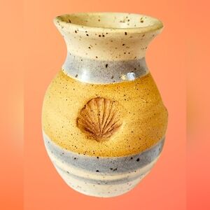 Small pottery vase with shell design. Blue gray glaze accents. Signed Flowers